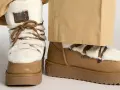Botas de invierno marrones con forro de pelo blanco y cordones. Perfectas para limpiar y mantenerlas impecables.