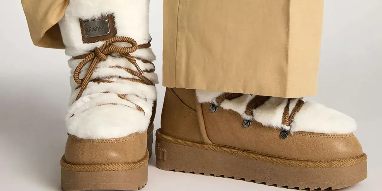 Botas de invierno marrones con forro de pelo blanco y cordones. Perfectas para limpiar y mantenerlas impecables.